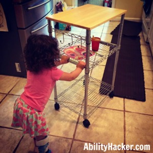 Using microwave cart to clear table for children with disabilities